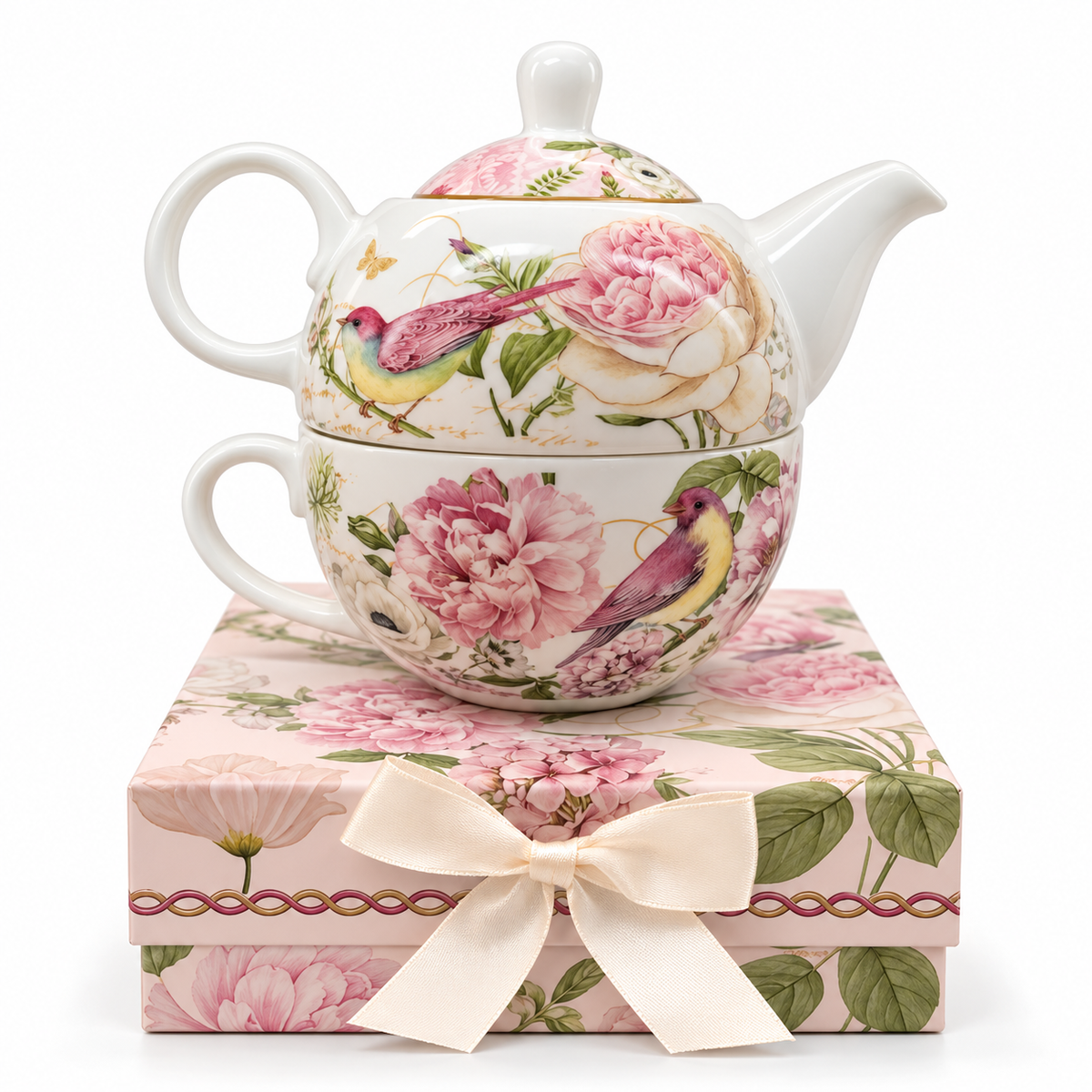Egoísta Aves y Peonías Rosadas con Caja: conjunto individual de tetera con tapa y taza a juego, con caja decorativa y lazo, sobre fondo claro.